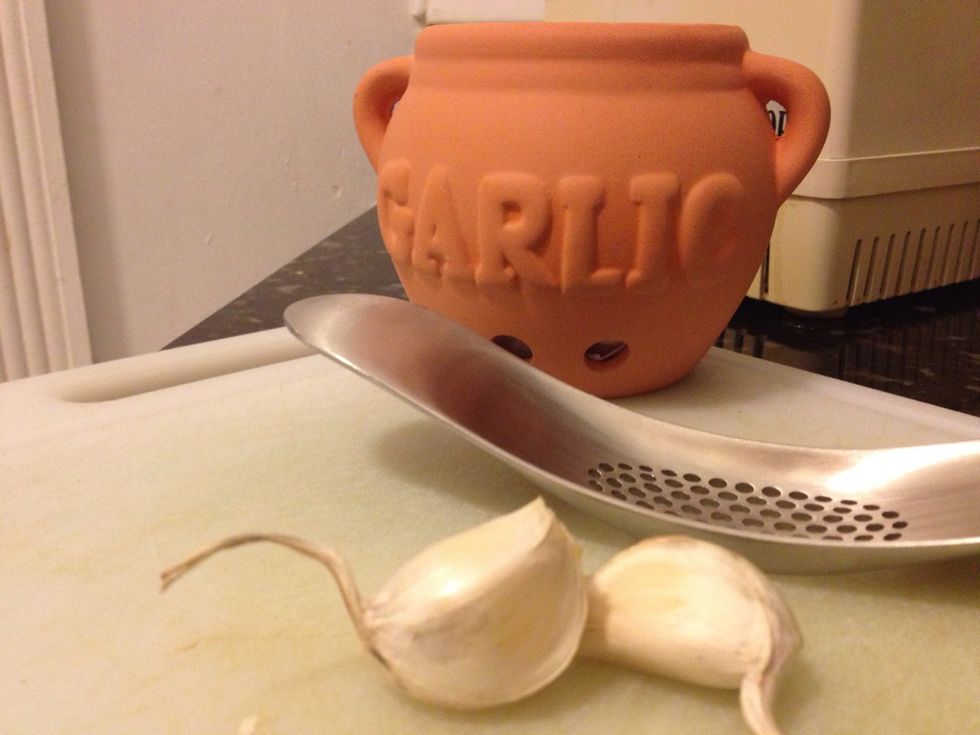 Two cloves of garlic is more than enough to give your pesto a good kick. I love this Joseph Joseph garlic presser. Washing your hands with it afterwards removes every bit of garlic smell from my hands
