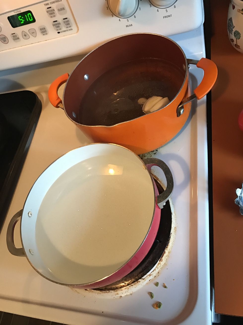 Two pots of boiling water:  1. For the pasta- add drizzle of EVOO, a garlic and a piece of onion  2. Just plain water for tomatoes