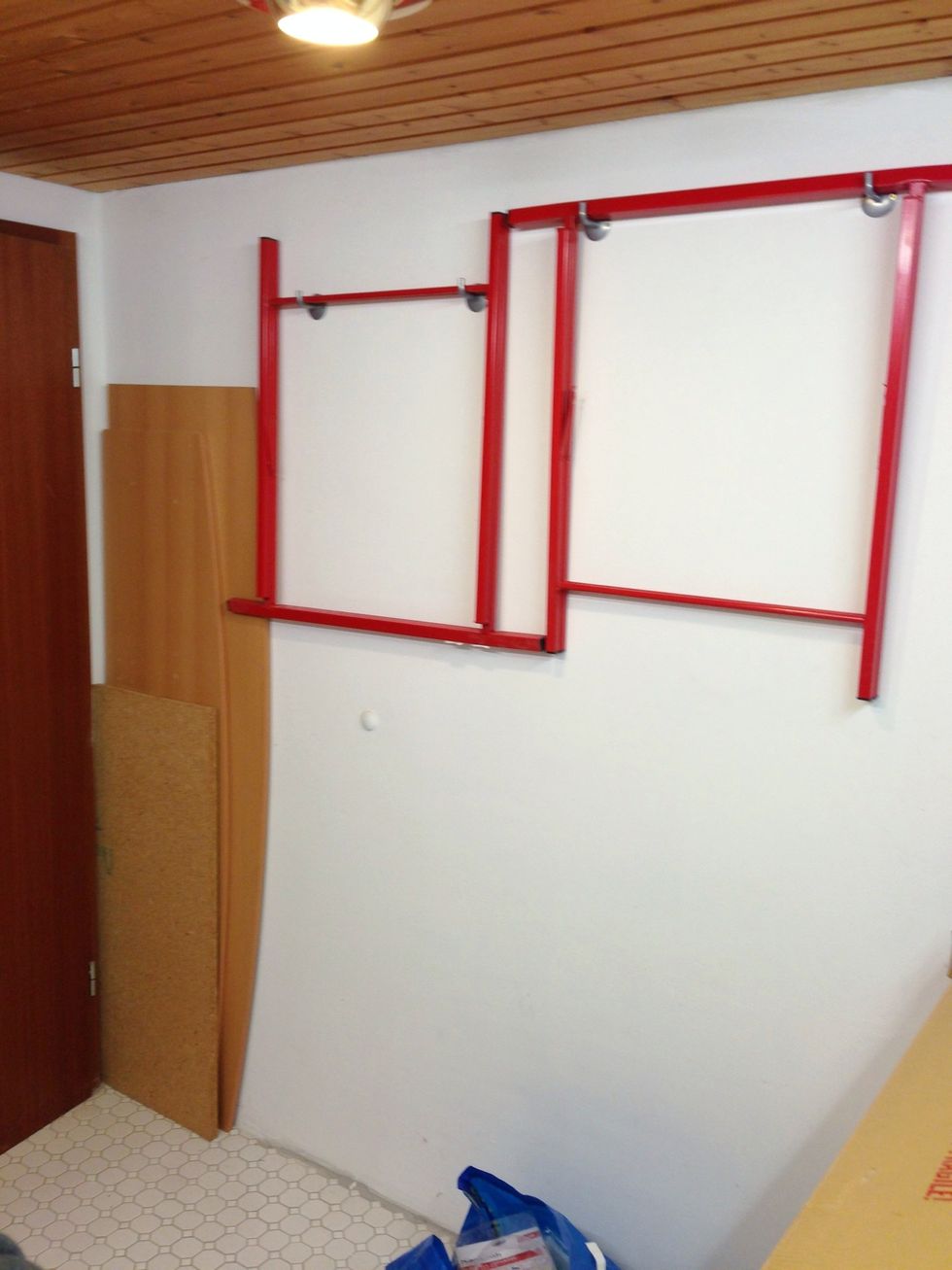 Two trestles and a plank make a great table any time you need one. Hang the trestles to the wall, the plank can be hidden behind the door.