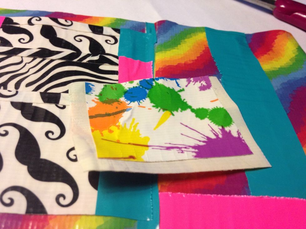 U can add a small piece of ducktape to the bigger piece like this now add another piece like that to this one and that will be the pocket for ur money!