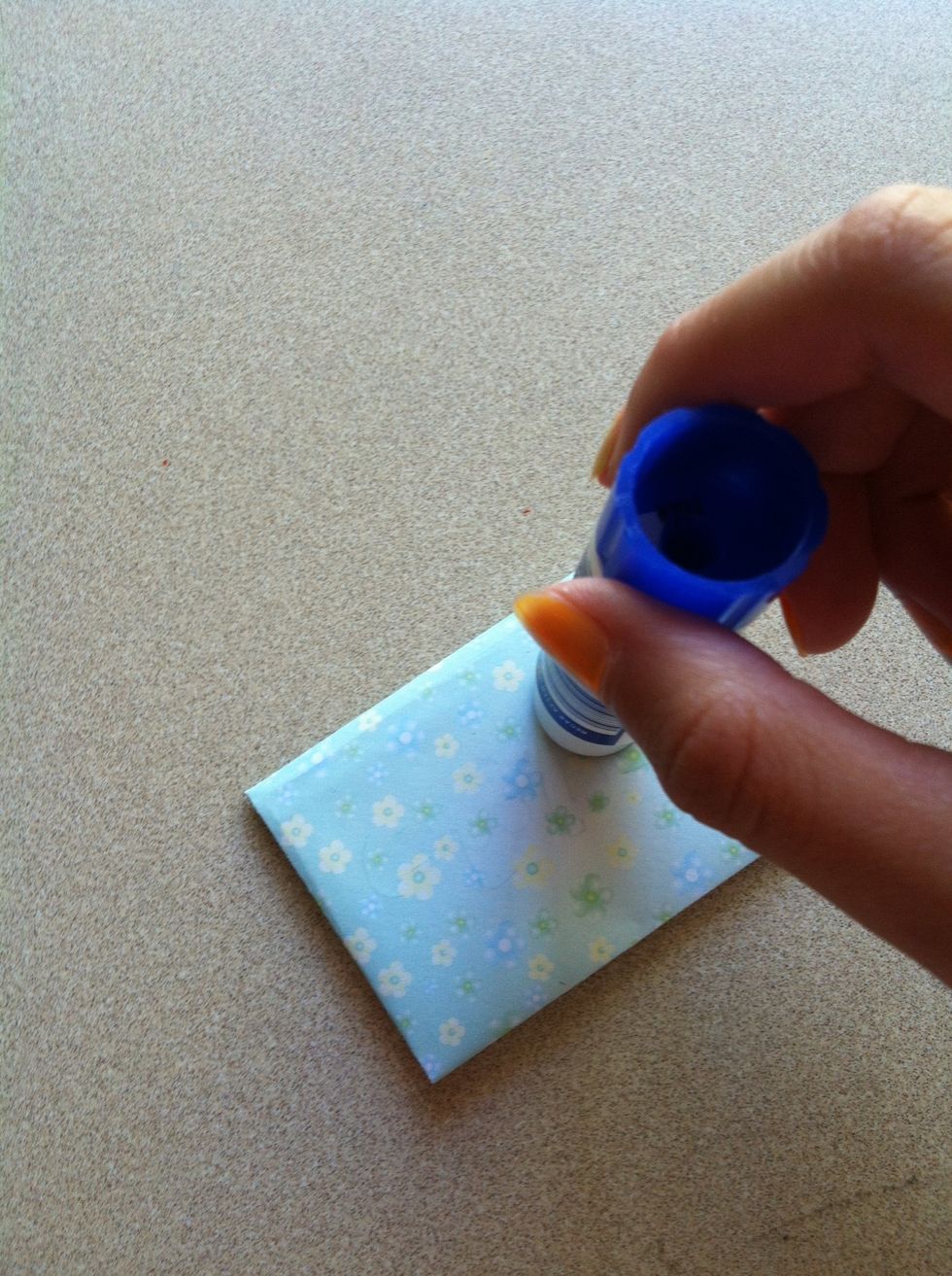 U can glue it to a gift by putting glue on the back