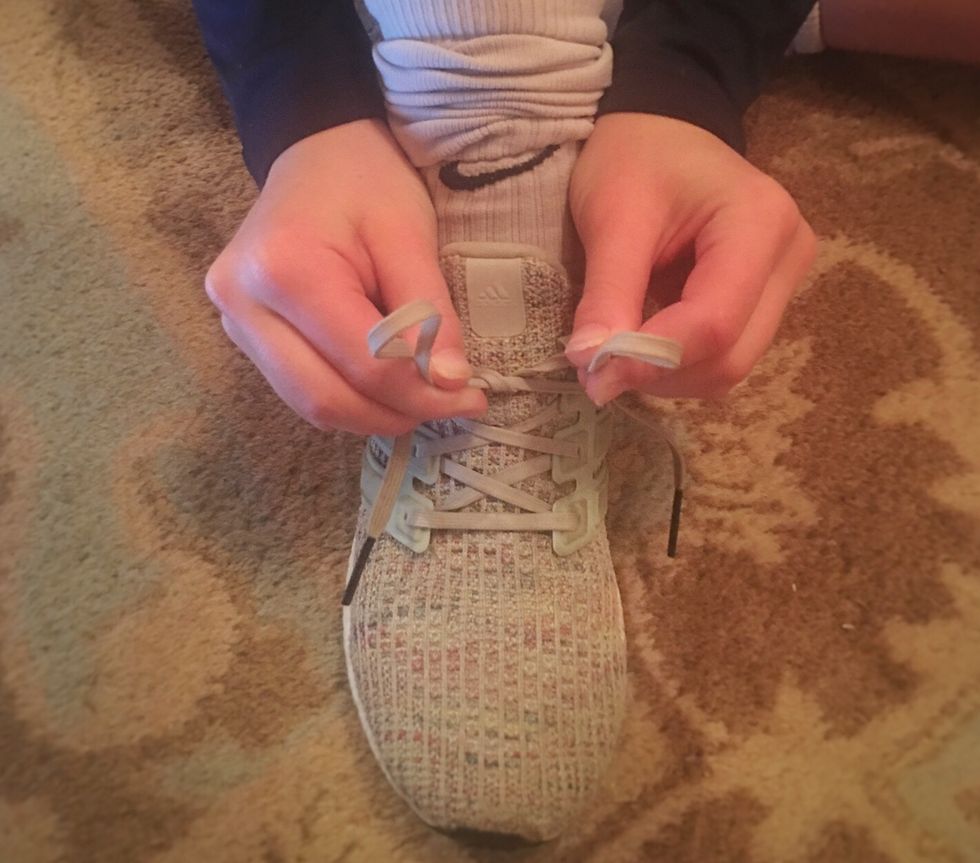 \u201cBunny ear method\u201d Make two loops.