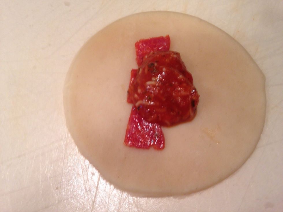 \u2022IMPORTANT: only put a teaspoon full of the mixture in the middle of the crust.\u2022 Then brush the edges with no sauce on it with water. Fold it over to make a crescent moon shape and push edges w/ fork.