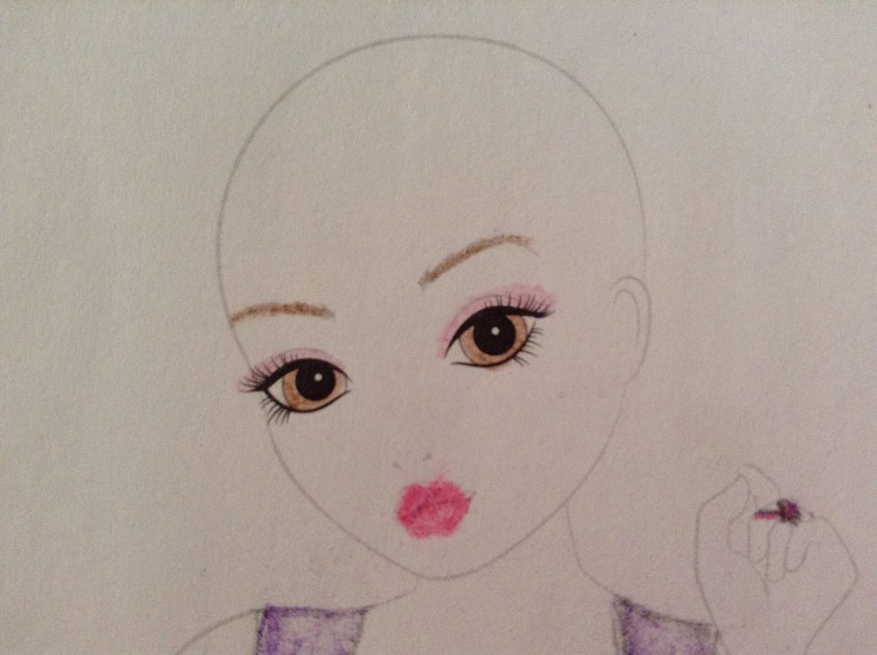\u2026 do the eyes and the eyebrows. Also, do the eyeshadow in pink or purple, your choice.