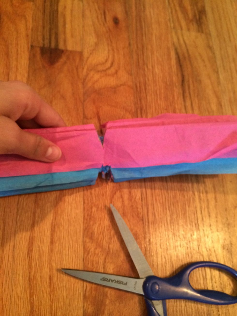 Un fold and cut little triangles on the folded crease.