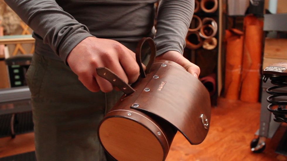 Un-weave the belt through 3 bag slots.