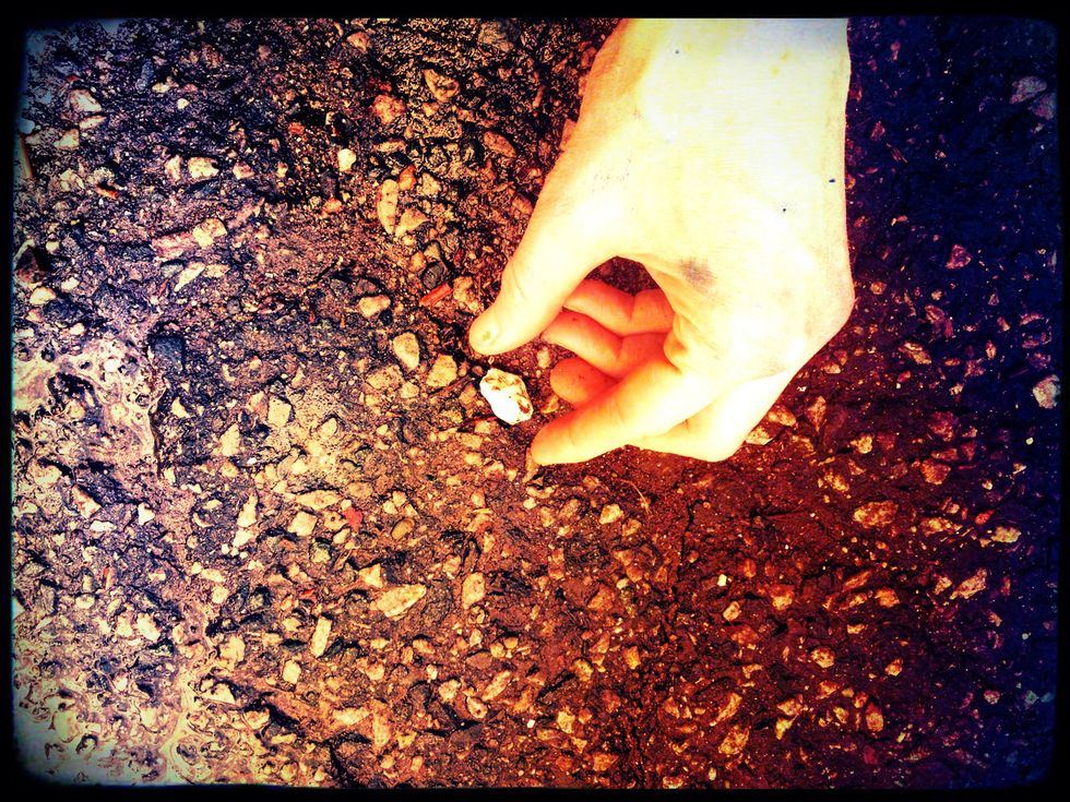 Uncle Fred proceeded to tell us that we were in for the magic trick of the century. He slowly searched the ground in front of the porch steps until he found the perfect pebble.