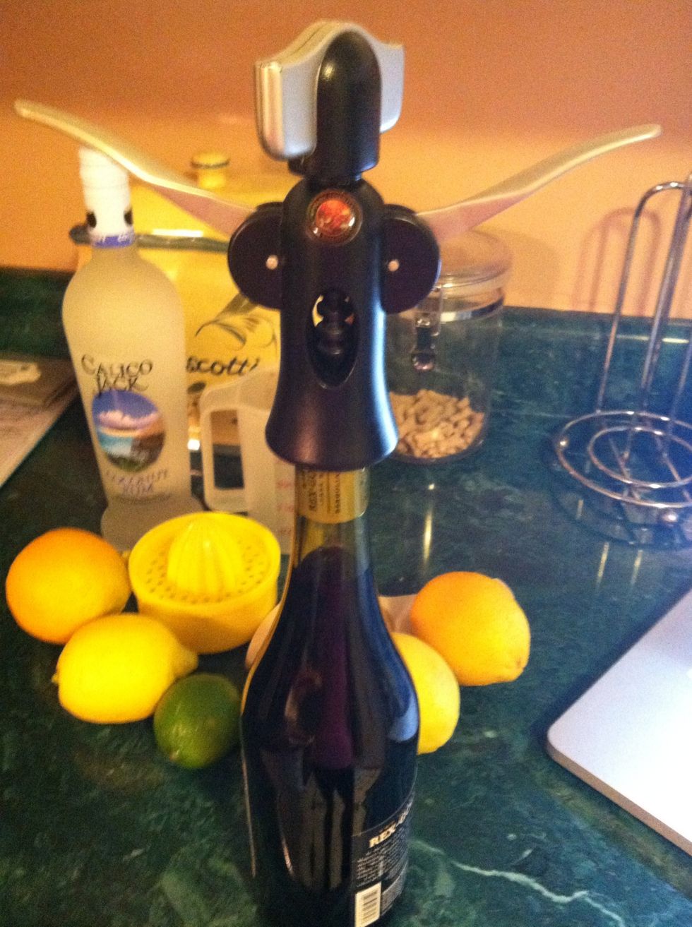 Uncork your wine...screw all the way into the cork