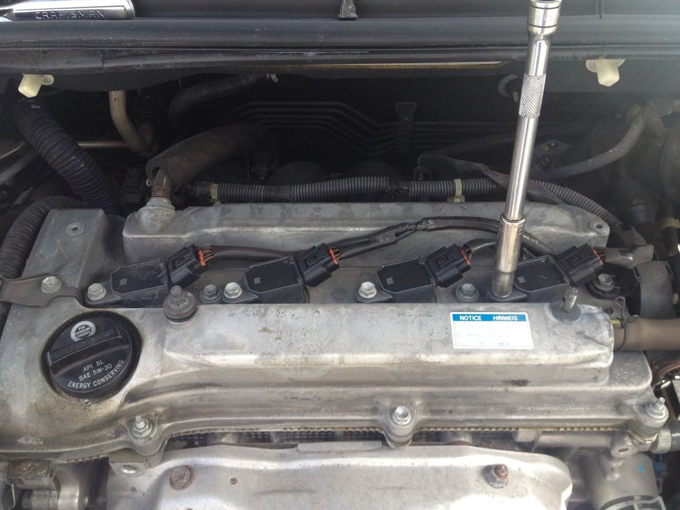 Under the cover you will see 4 coils, they also come off with a 10mm socket