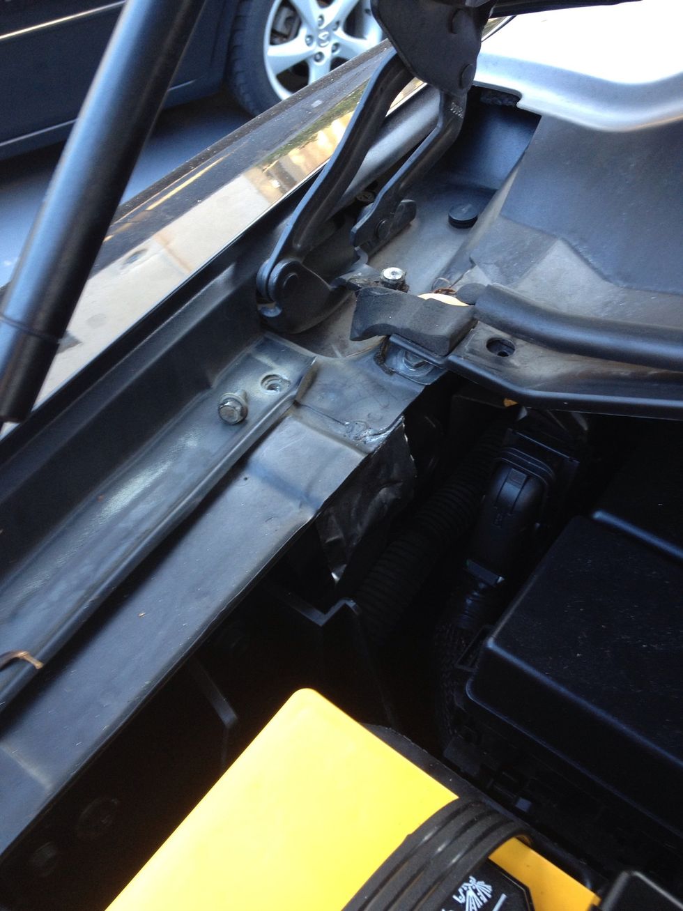 Under the hood, I removed one of the bolts that held on the fender