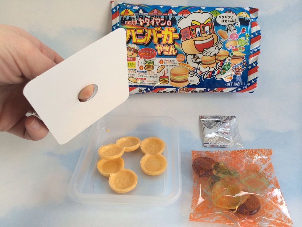 Under white lid are Burger Buns made of fragile wafer, be careful