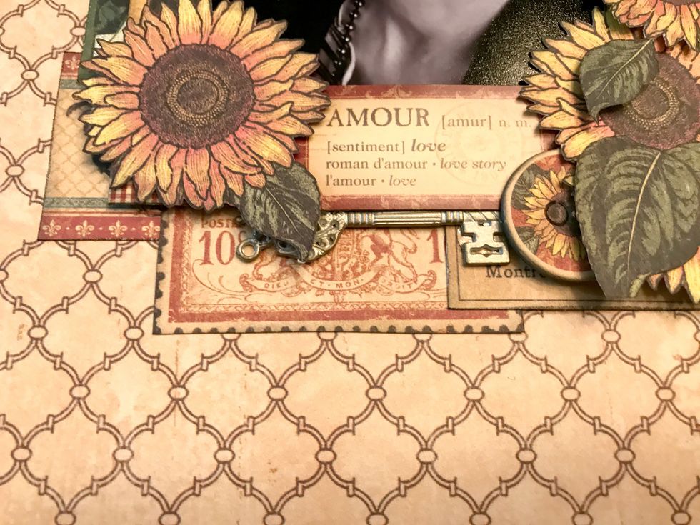 Underneath the "Amour" sticker, adhere a shabby chic ornate metal key.
