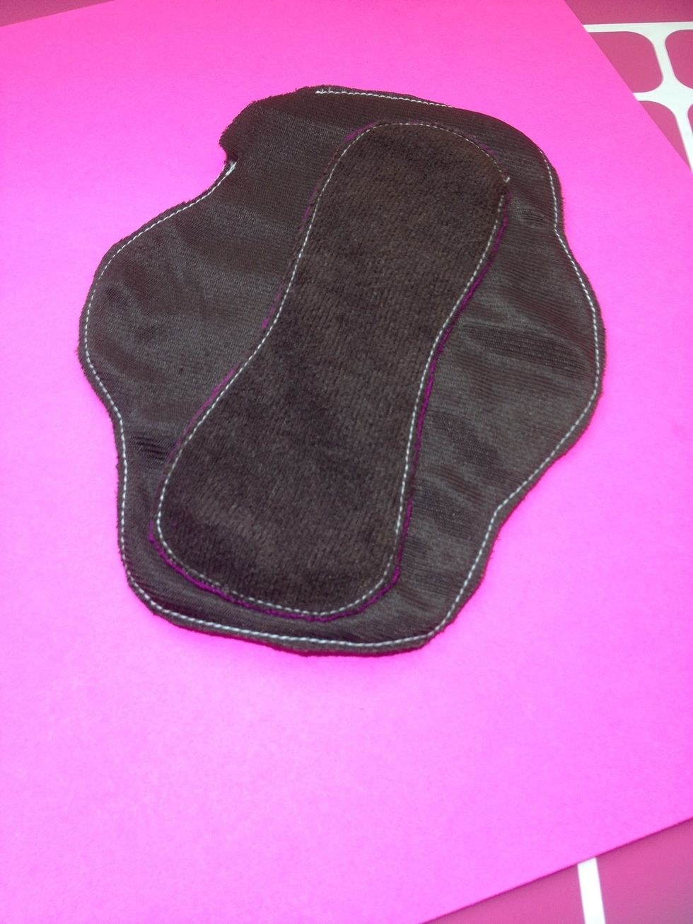Underside of pad before I turn and top stitch it. Looks like I was a little tilted to the right of center! LOL oh well practice makes perfect. Now let's turn it inside out!