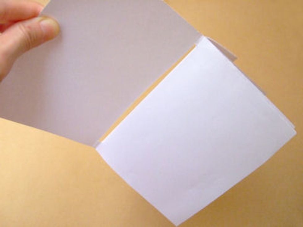 Undo your stapler and staple the papers all together.