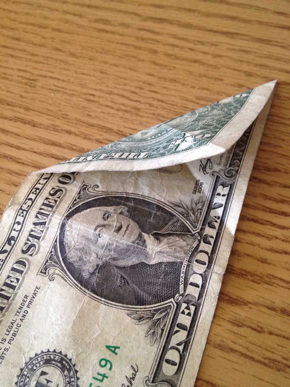 Unfold and fold down the other corner like so.