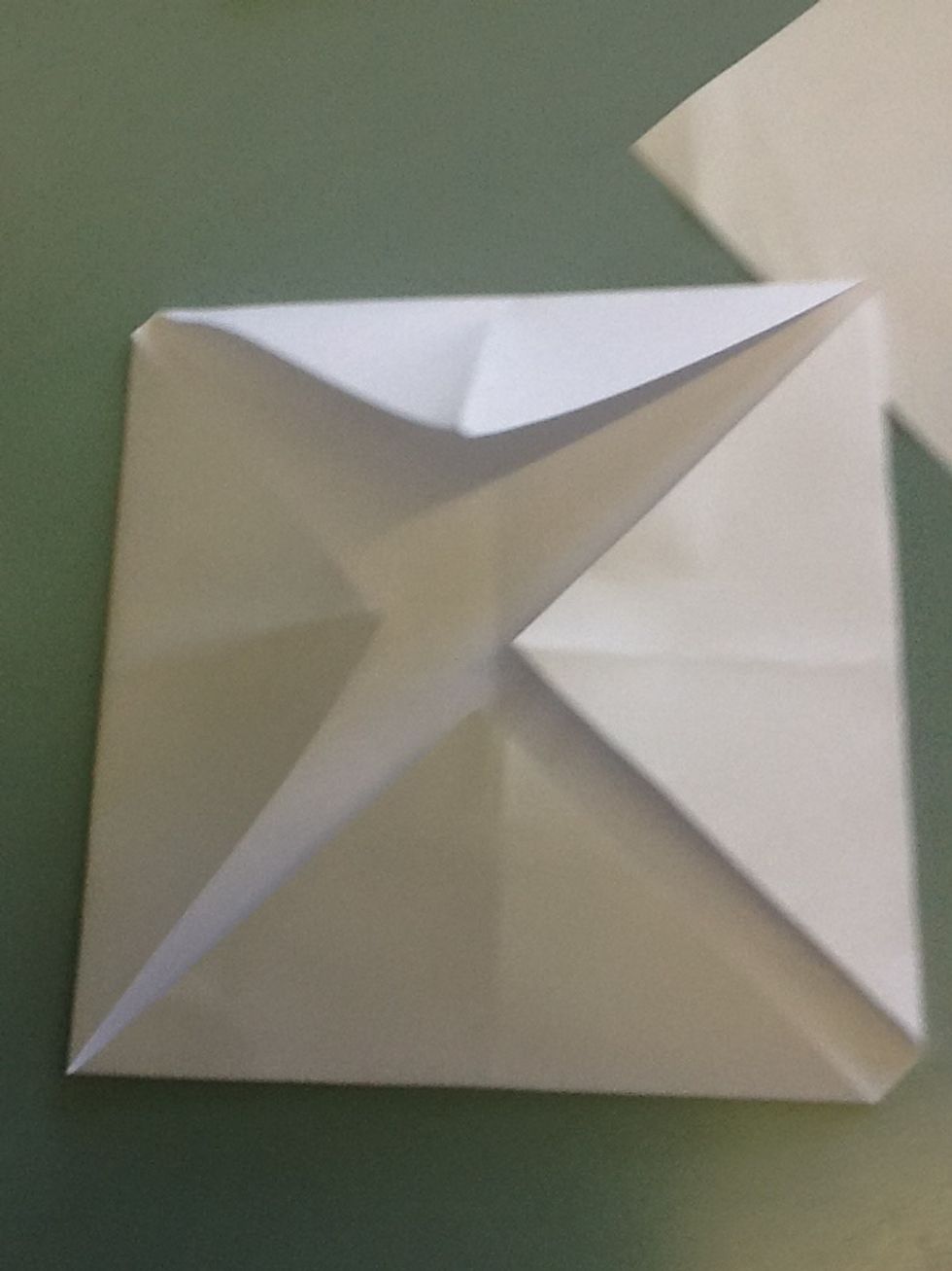 Unfold and fold the corners into the centre