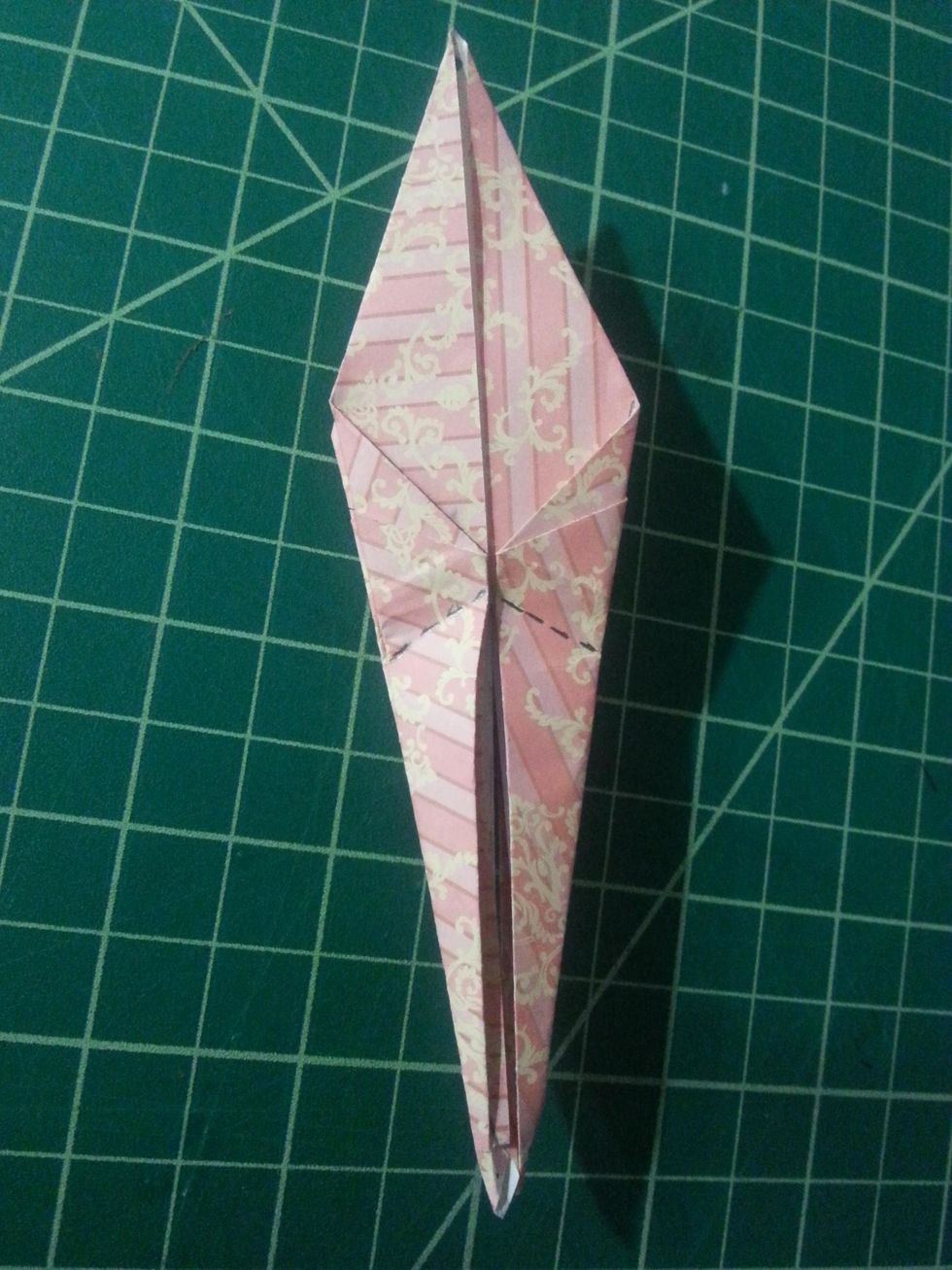 Unfold both flaps, pull the right side out to the right and up (inward), and flatten.  That is the Inside Reverse Fold. We will do the same for the left side.