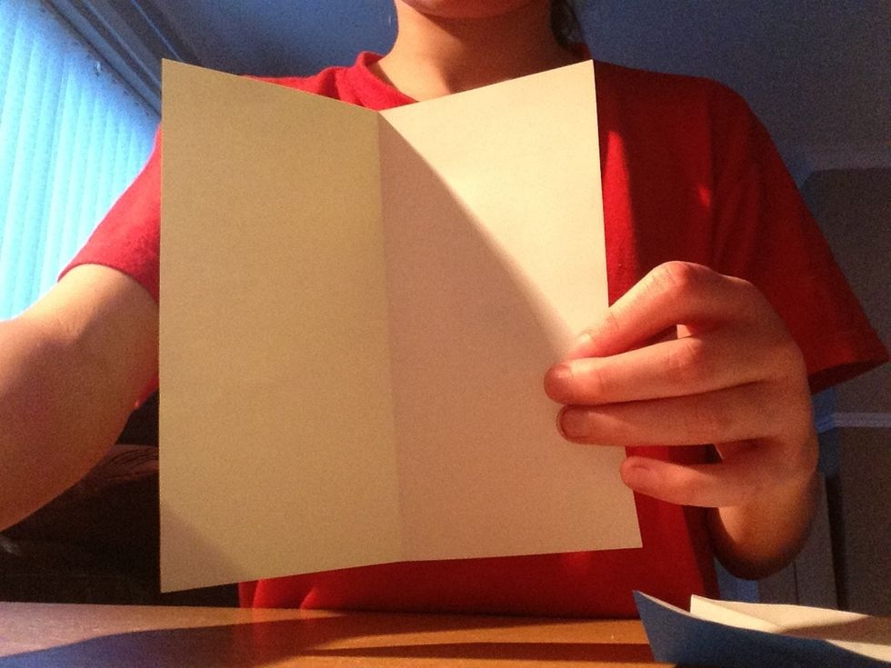 Unfold it to find a crease down the middle