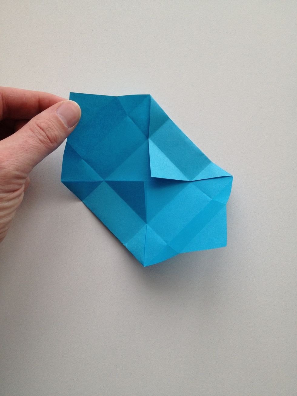 Unfold one of the upper and one of the lower triangles.