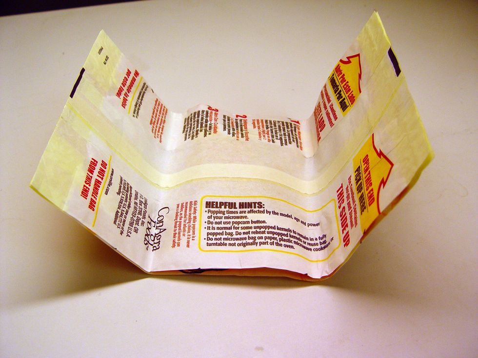 Unfold the bag and make sure you lay it down properly,it says on one side "This side is up".