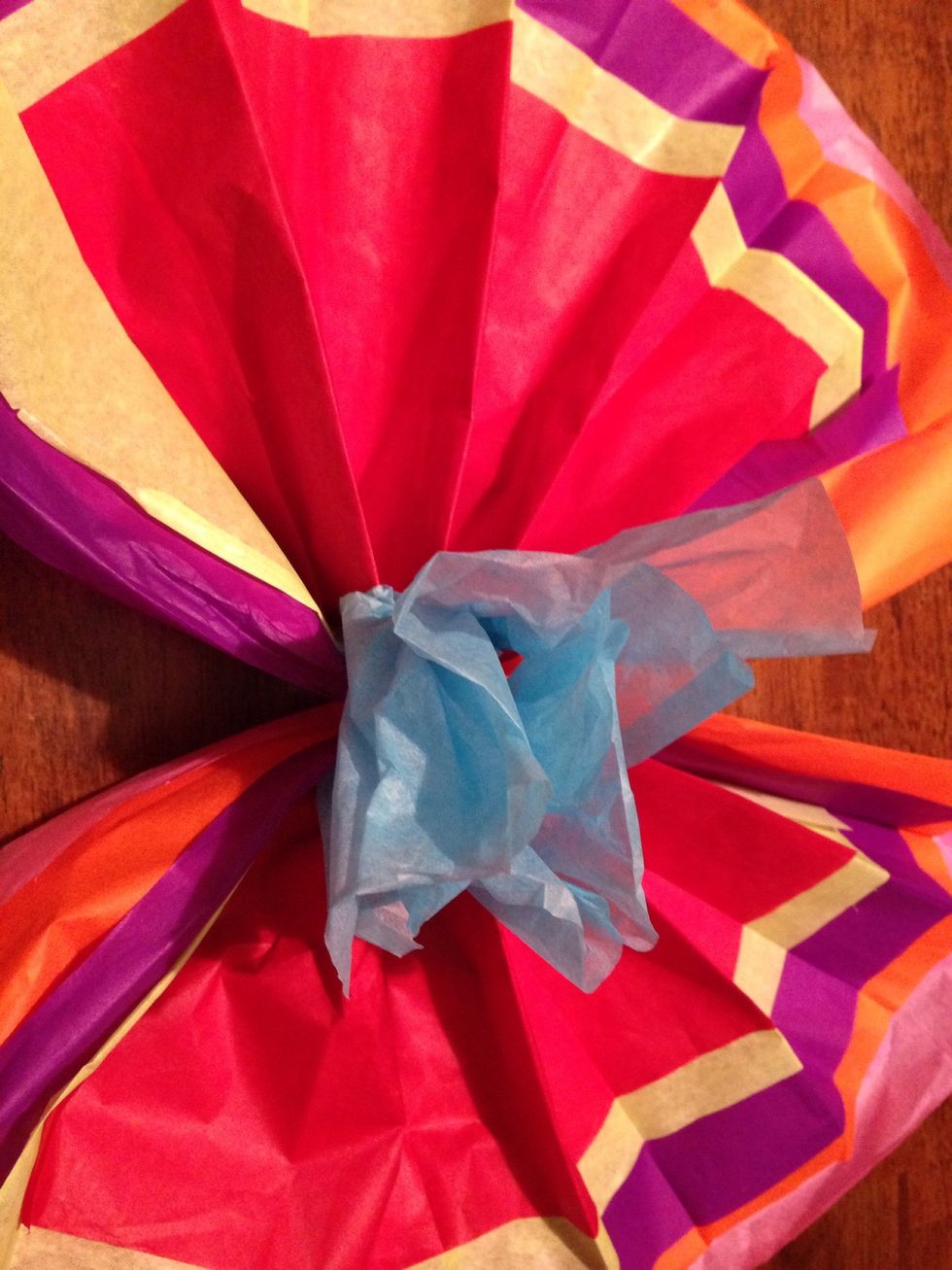 Unfold the flower, start with the center and finish with the last layer.