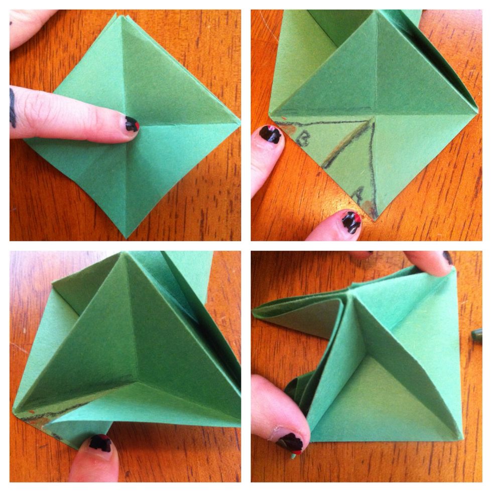 Unfold the last fold you made. You're looking at a diamond shape now. You're going to fold that bottom left triangle in half (make A go to B).