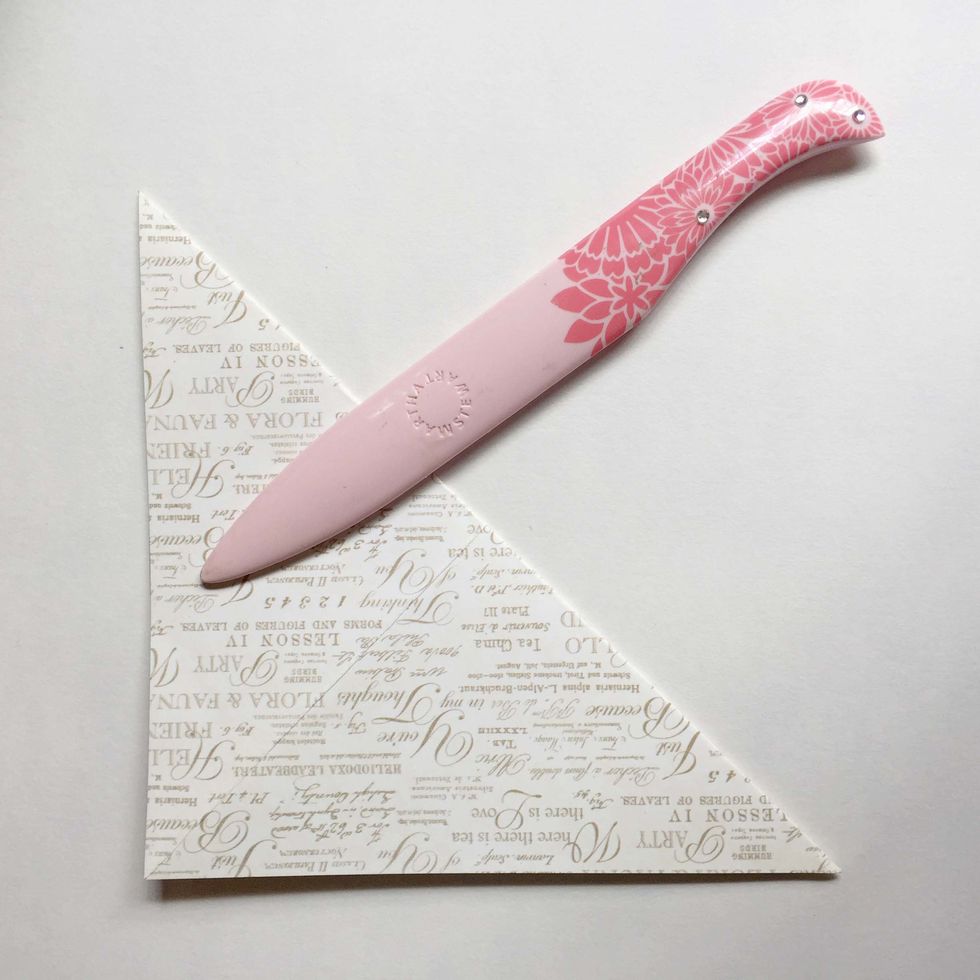 Unfold the paper and fold the other end diagonally... Give it a good burnish...