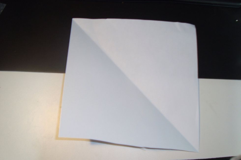 Unfold the paper and lay it flat.