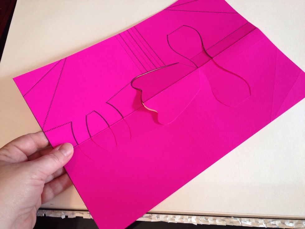 Unfold the paper. Turn over.