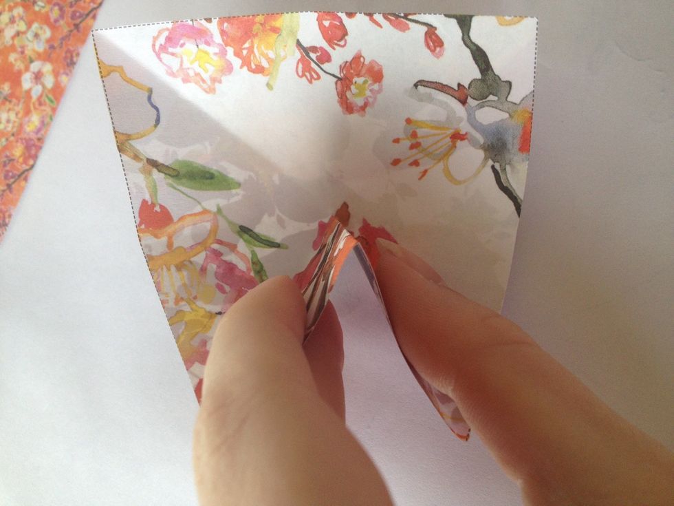 Unfold the piece of paper.. Then pinch the inside of your paper to create a point