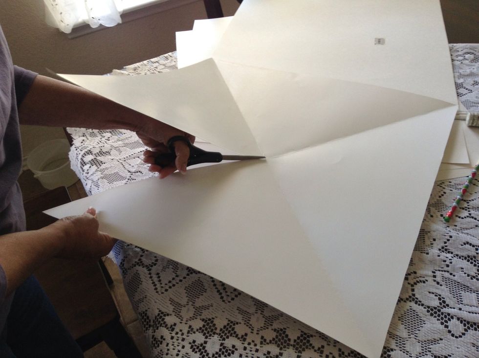 Unfold to view the four triangles. Cut one line to the center ONLY!