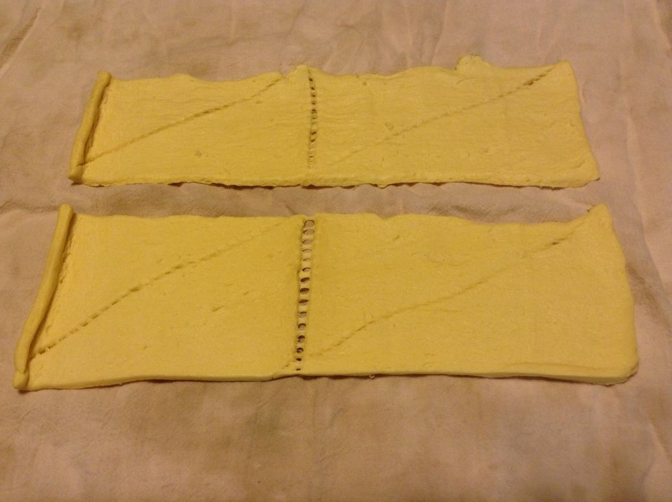 Unleash the contents of a can of crescent rolls and place in two rectangular halves...