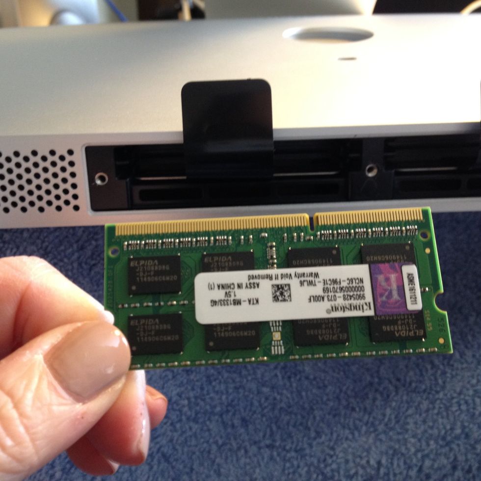 Unpack the new RAM avoiding touching the gold plated edge - position it with the gap on the right hand side