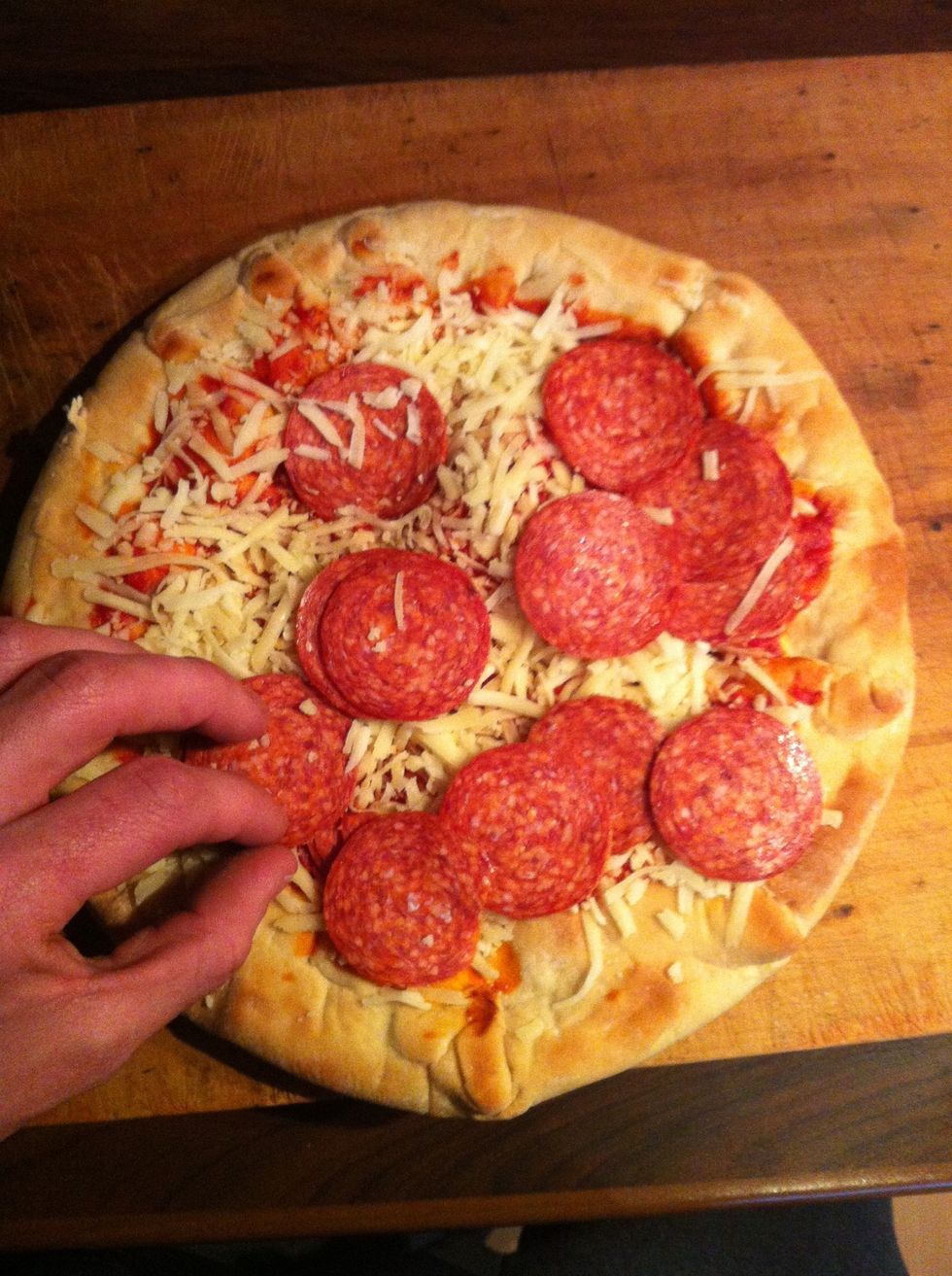 unpack the pizza and arrang the toppings, this is when you can add new toppings.    ( carefull don't ruine your pizza !!! )