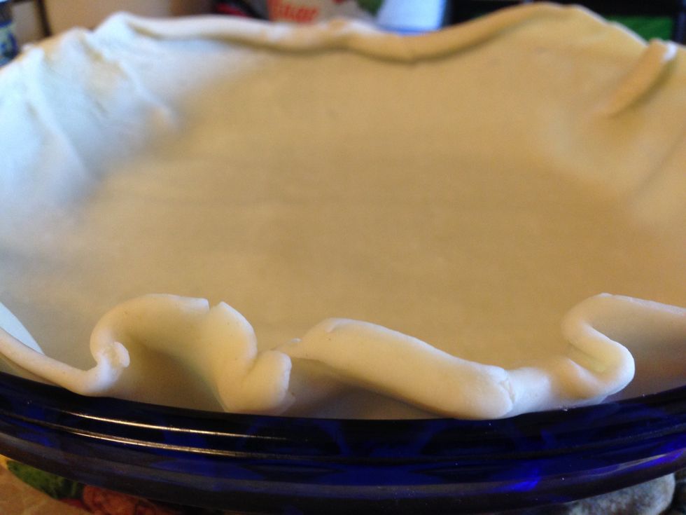 Unroll a pastry sheet into one of the two 9-in pie plates.