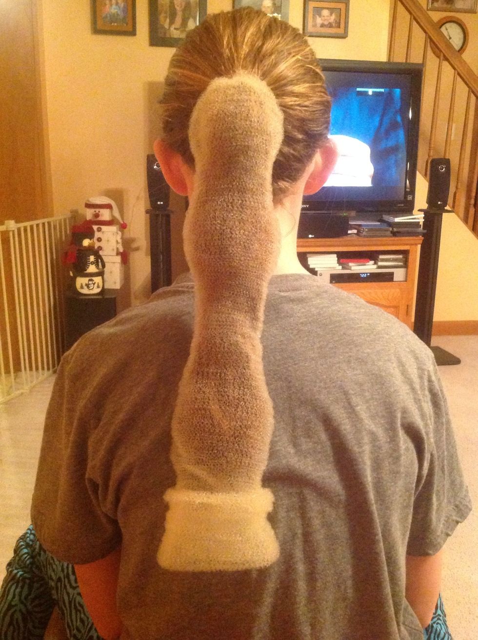 Unroll "Bun Ease" down your ponytail.