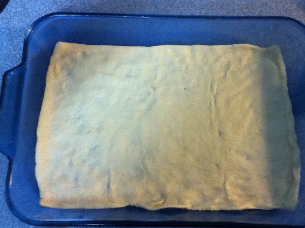 Unroll crescent dough sheet, and place in bottom of pan, stretching some to fit.
