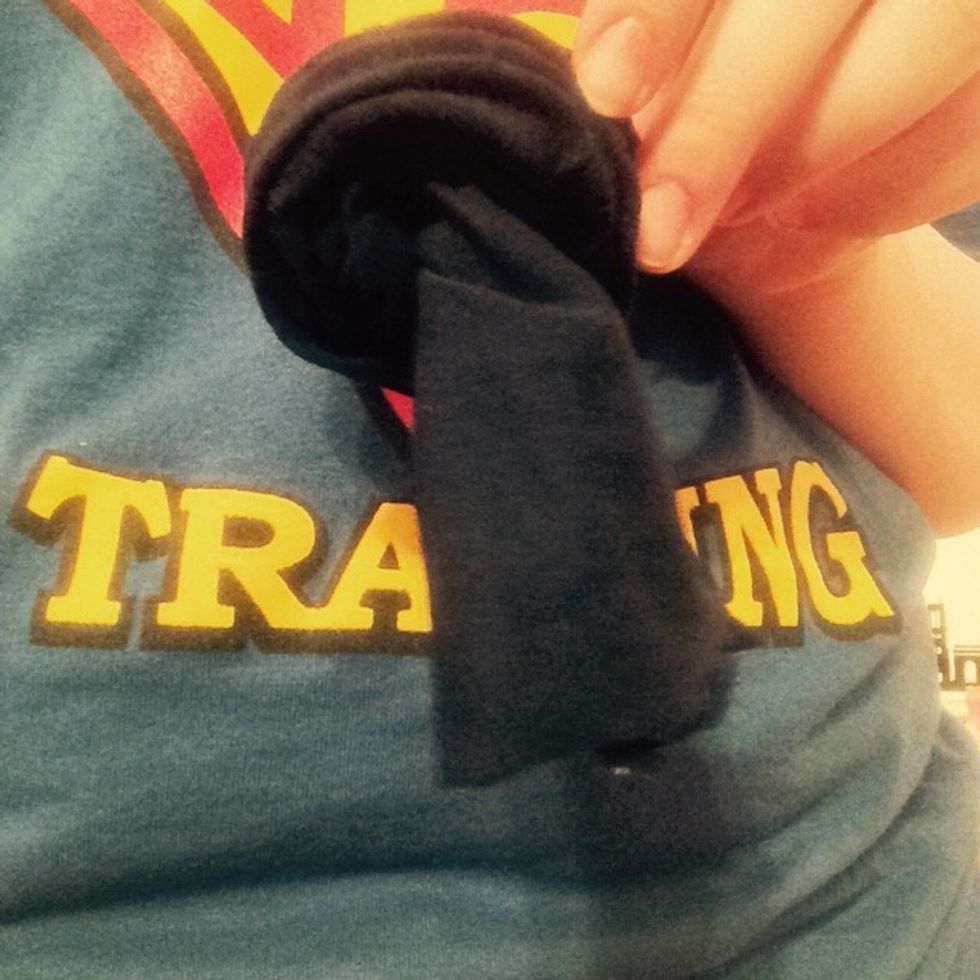 Unroll it about 2 times, leaving a tail.