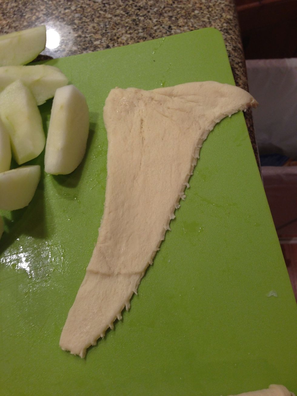 Unroll the crescent rolls and obtain one triangle slice