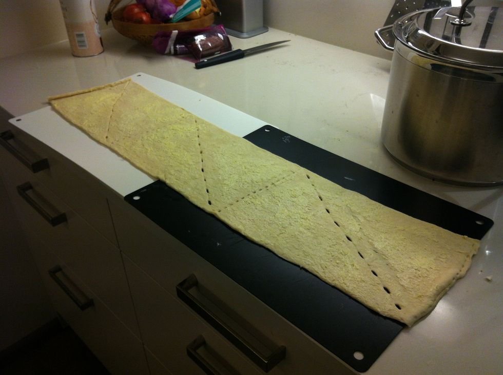 Unroll the dough and layer with butter