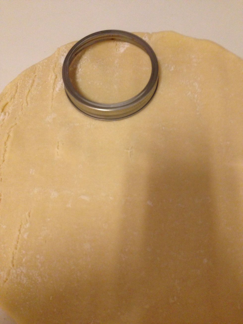 Unroll your chilled dough and use a circle cookie cutter or the rim of a large Mason jar to cut the bottom crusts. I was able to cut 7 circles out of each 9" crust. Don't throw away your scrap crust!