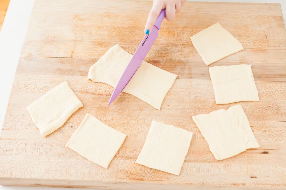 Unroll your dough sheet and cut into 8 equal squares.