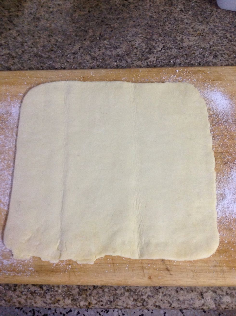 Unroll your puff pastry sheet and roll it out to 10x10 inches (25 cm) square. If using frozen pastry, let it thaw in the refrigerator overnight before using it.