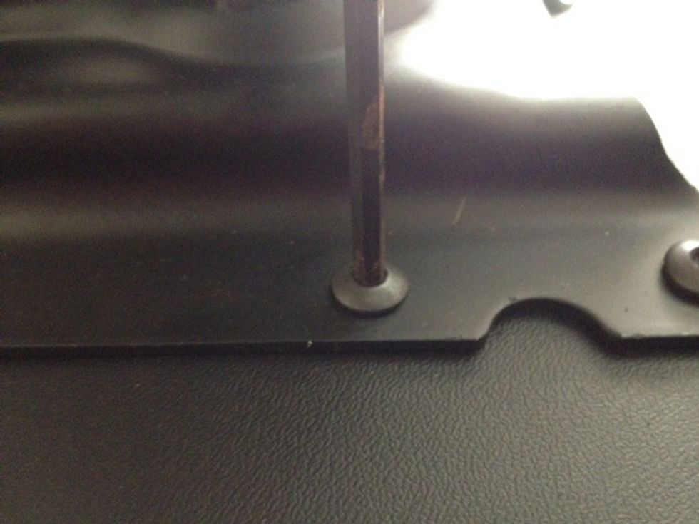 Unscrew all the parts of the chair until you get to the fabric covered seat.