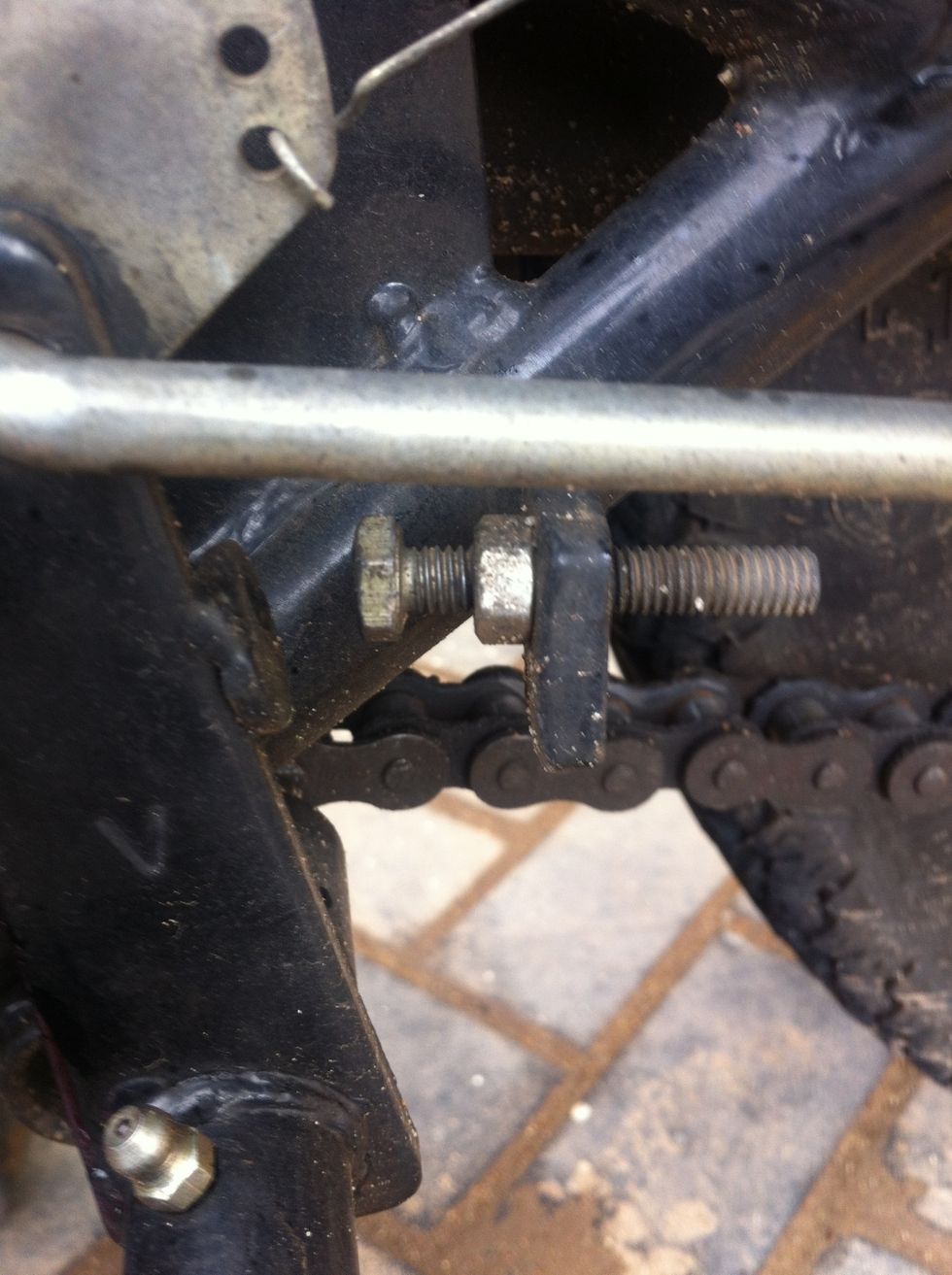 Unscrew brake lever stopper bolt to desired level