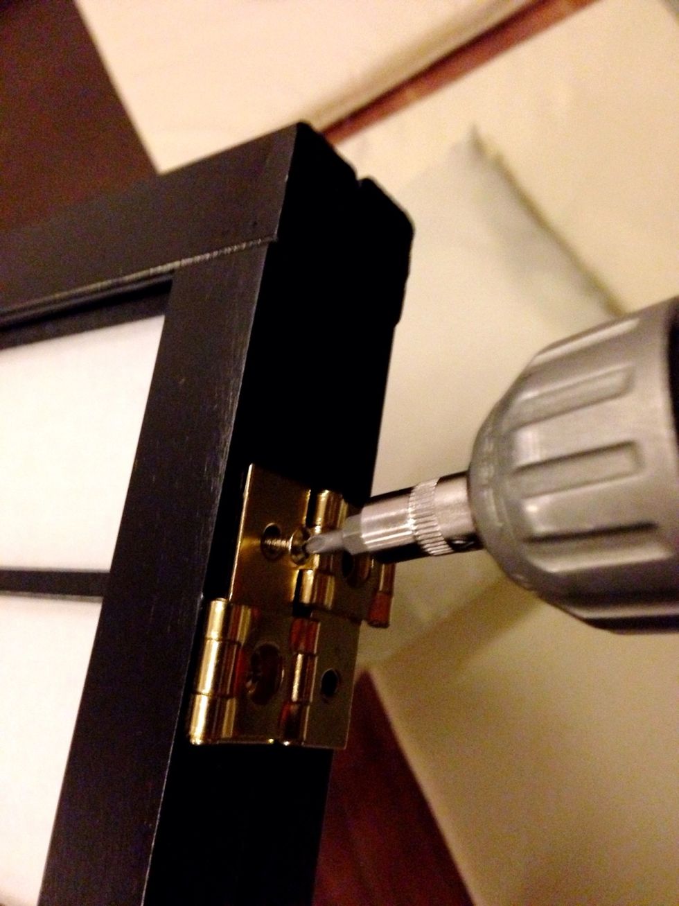 Unscrew the hinges from the long sides...