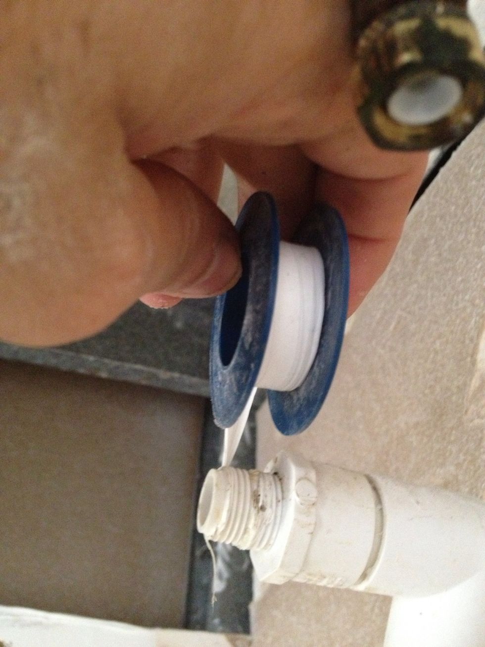 Unscrew the valve all the way, counting the number of turns it takes to come off. Remember that number for later. Then tape the hell out of the threads with Teflon tape.