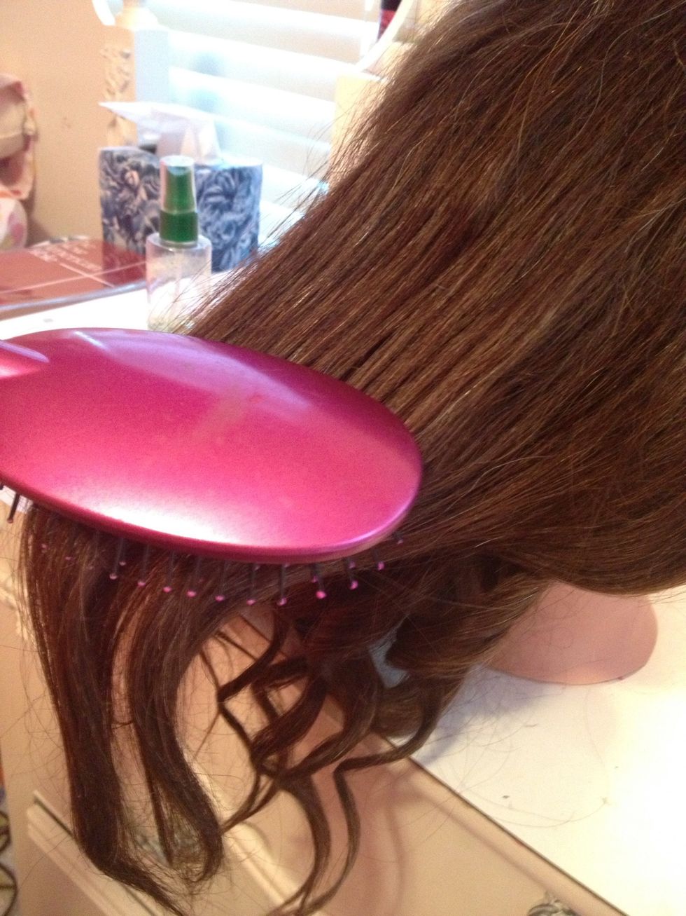 Untie and brush out the other top section of hair.