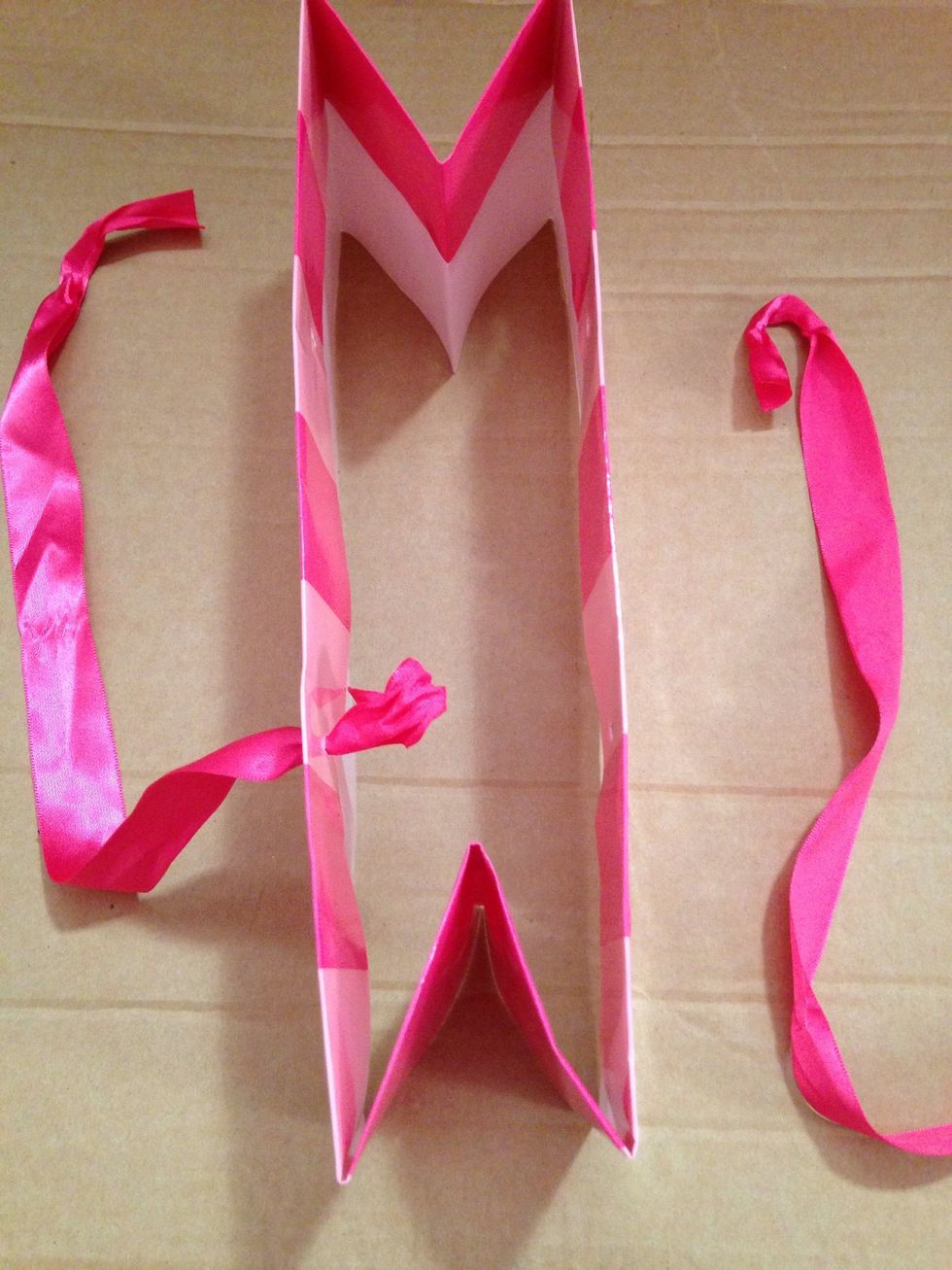 Untie handles & remove. (Edit: May want to do this as your 1st step before any cutting is done.)