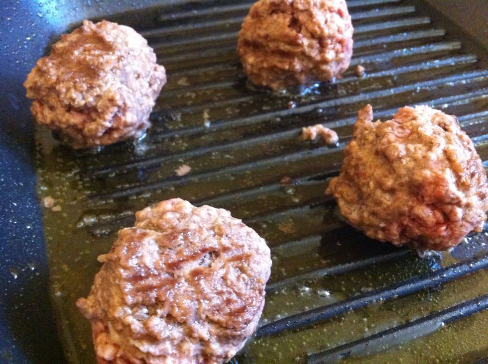 Until meatballs are golden brown.